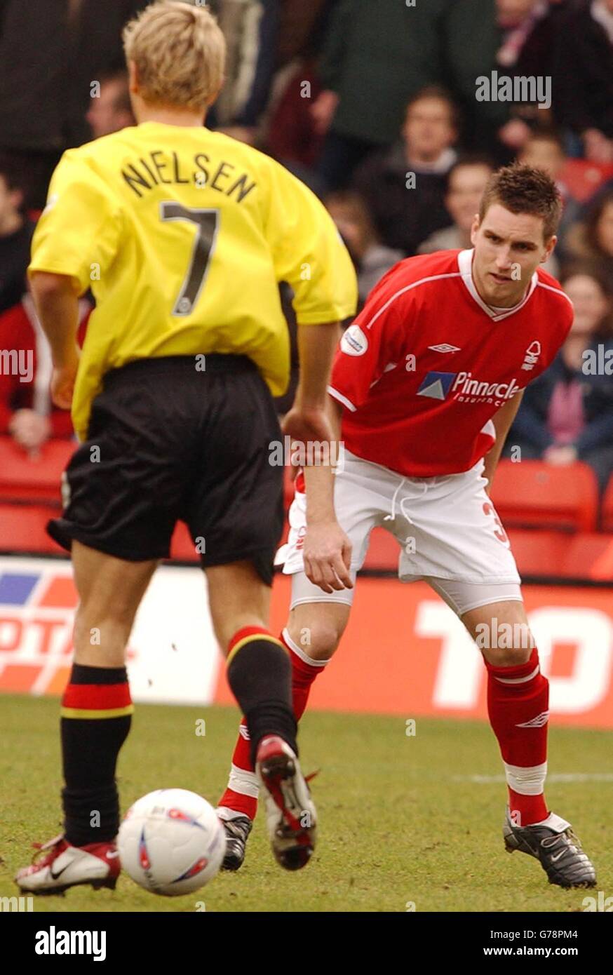 Watford's Allan Nielsen (L) goes past Nottingham Forest's Jim Brennan during the Nationwide Division One match at Vicarage Road, Watford. The game ended a 1-1 draw. NO UNOFFICIAL CLUB WEBSITE USE. Stock Photo