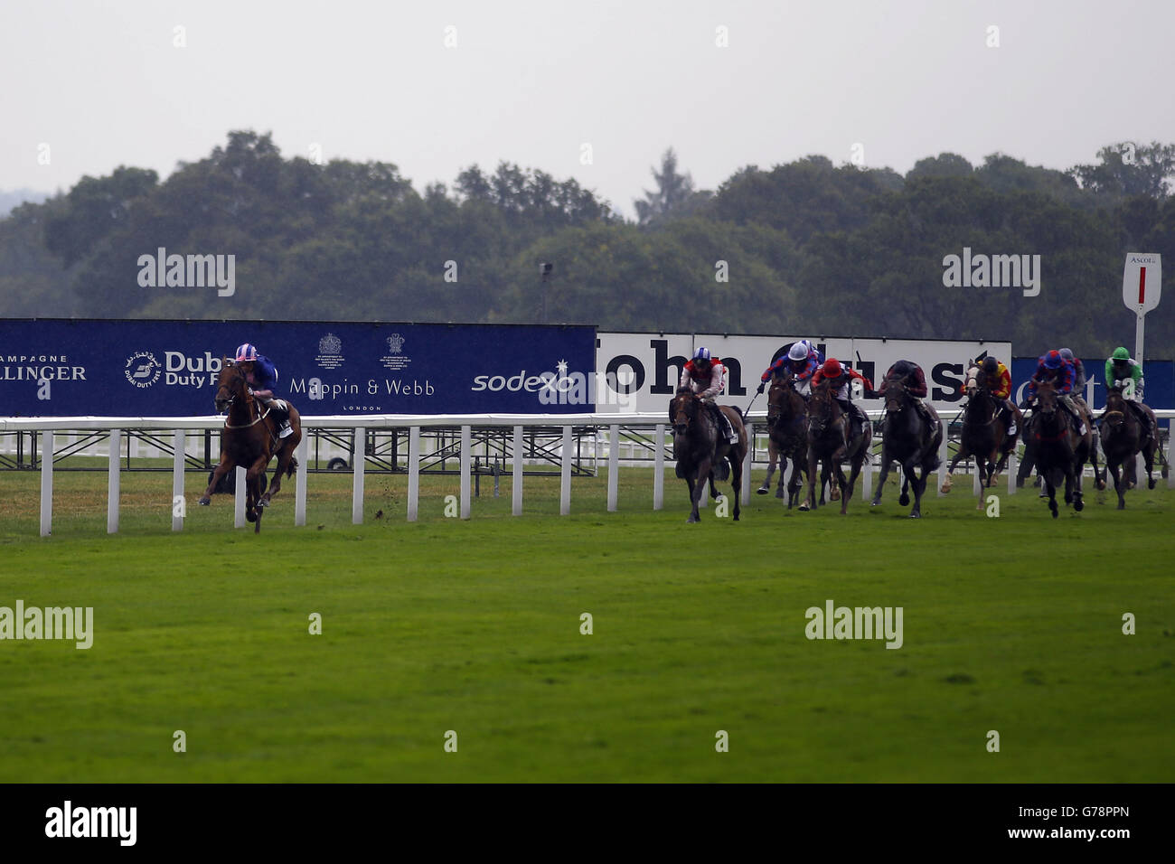 Maid in Rio ridden by Silvestre De Sousa (left) wins the John Guest Brown Jack stakes during the King George Friday at Ascot Racecourse. Stock Photo