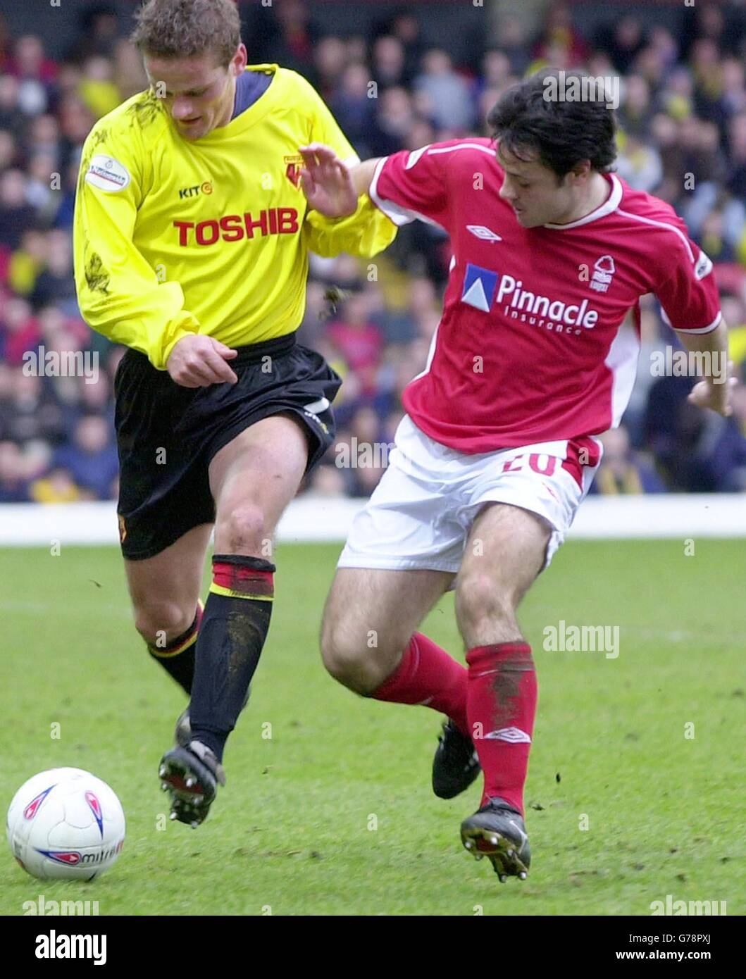 Watford's Neal Ardley (L) is challenged by Nottingham Forest's Andy Reid during the Nationwide Division One match at Vicarage Road, Watford. The game ended a 1-1- draw. NO UNOFFICIAL CLUB WEBSITE USE. Stock Photo