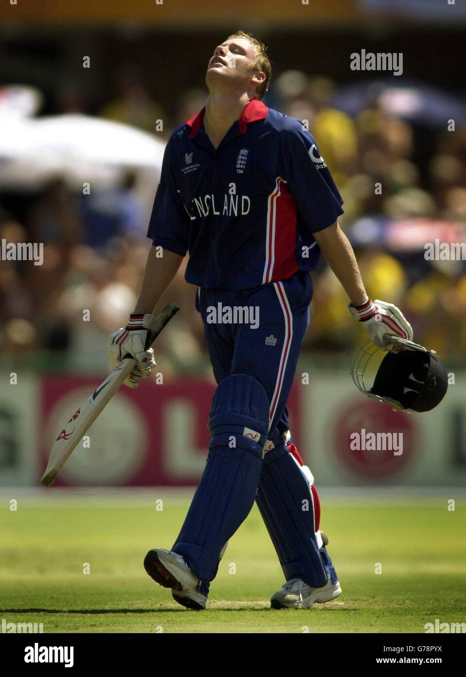 England's Andrew Flintoff leaves the field after being caught by Australia's Adam Gilchrist off the bowling of Andy Bichel for 45 runs during their final Group A Cricket World Cup match at St George's Park, Port Elizabeth. England won the toss and elected to bat first. Stock Photo