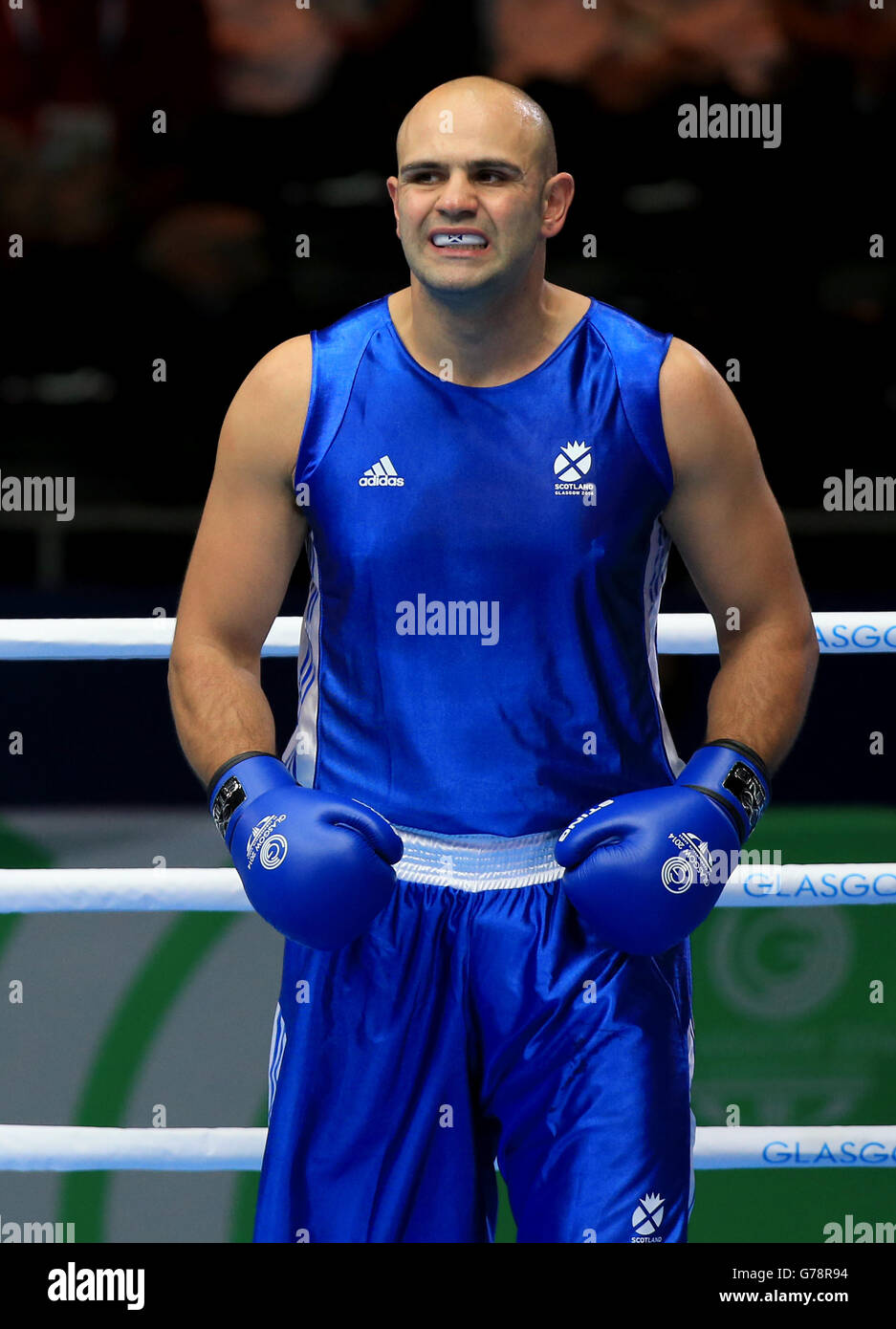 Scotland's Ross Henderson during his fight against India's Parveen ...