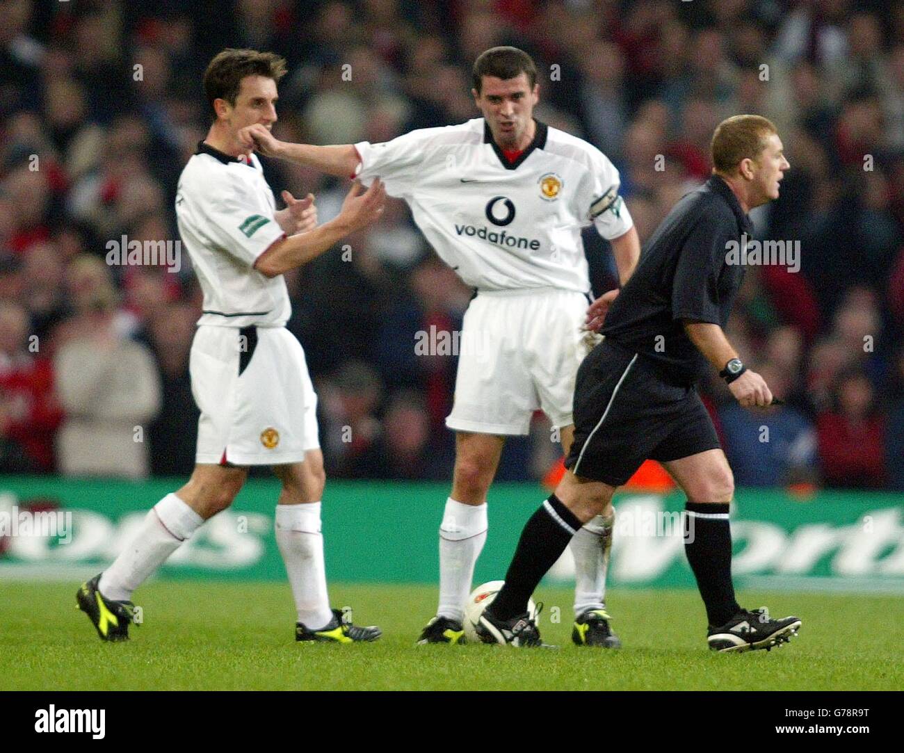 Manchester United captain Roy Keane (centre) argues with Gary Neville
