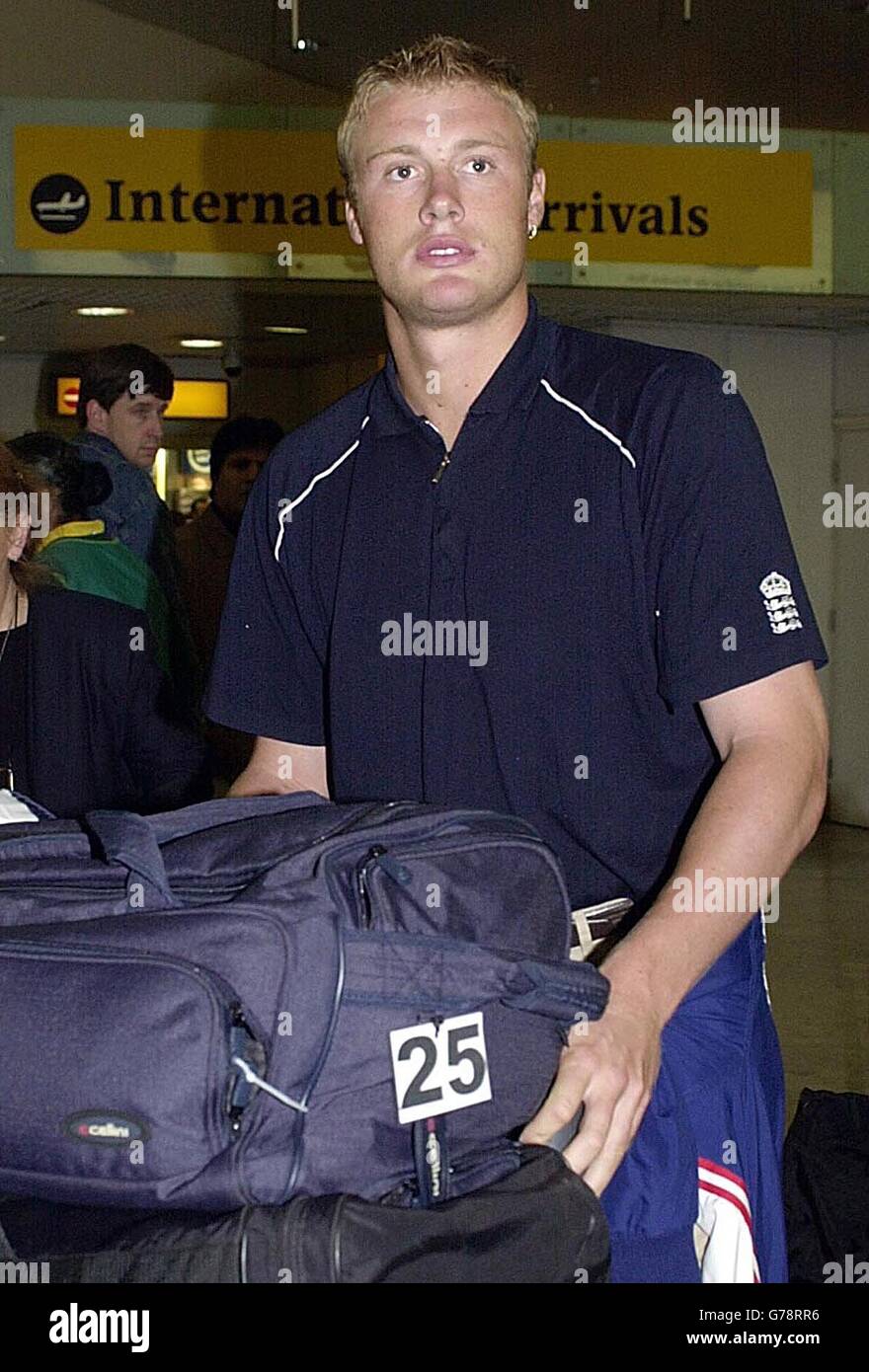 EDITORIAL USE ONLY - NO COMMERCIAL USE: England cricketer Andrew Flintoff arrives at Heathrow Airport, after being knocked out of the ICC World Cup in South Africa. Michael Vaughan has admitted he wants to be the next England one-day captain. * The Yorkshire opener is favourite to succeed Nasser Hussain, who quit the post when England failed to reach the Super Six stage of the World Cup in South Africa. Vaughan revealed his friend and England colleague Marcus Trescothick, the other leading contender for the captain s job, would also relish the opportunity. Stock Photo