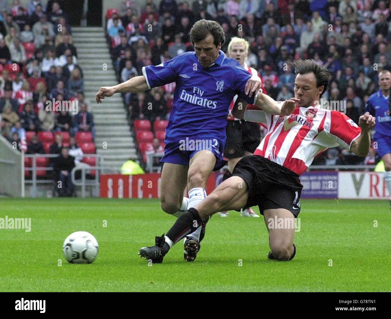 Sunderland's Joachim Bjorklund tries to get the ball from Chelsea's