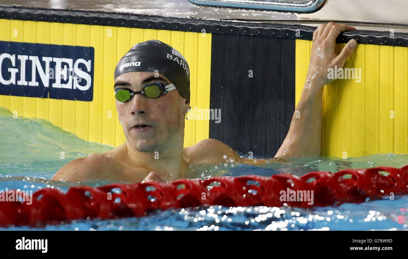 England's Adam Barrett after winning the Men's 100m Butterfly Semi-final 1, at Tollcross Swimming Centre, during the 2014 Commonwealth Games in Glasgow. Stock Photo