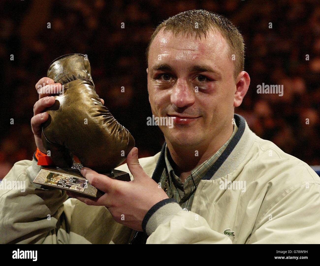 Birmingham's Peter Buckley with a trophy presented to him by the British Boxing Board of Control (BBBC) at the MEN Arena in Manchester, after his 200th professional fight. Buckley is the first British fighter for 50 years to reach the milestone. Stock Photo