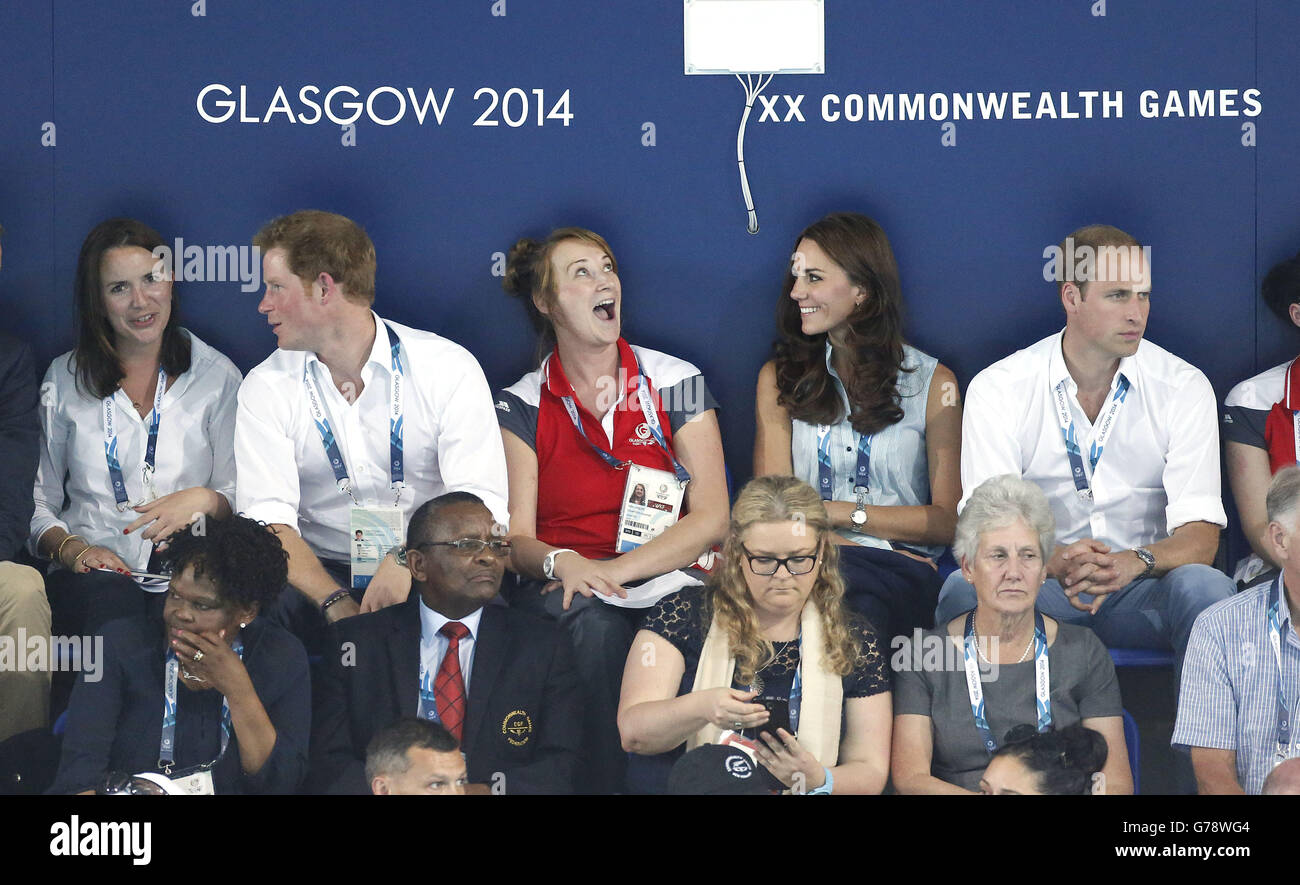 Prince Harry (2nd left) and the Duke and Duchess of Cambridge (right) watching swimming at the Tollcross Swimming Centre, during the 2014 Commonwealth Games in Glasgow. Stock Photo