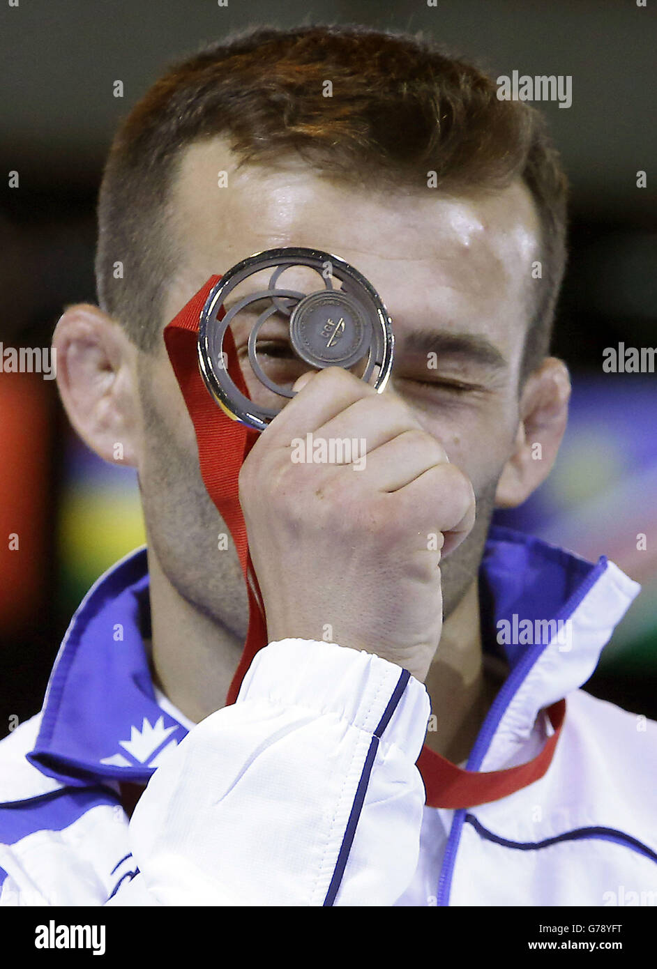 Scotland's Viorel Etko with his bronze medal from the FS 61 kg wrestling at the SECC, during the 2014 Commonwealth Games in Glasgow at the SECC, during the 2014 Commonwealth Games in Glasgow. Stock Photo