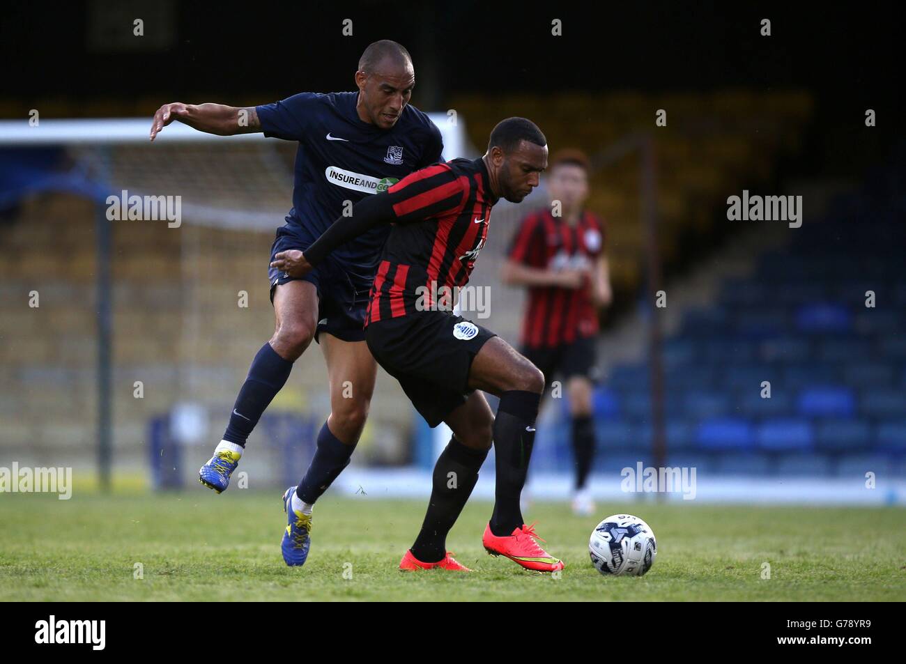Southend United's Craig Fagan, (left) battles for possession of the ball with Queens Park Rangers' Matt Phillips during the pre-season friendly at Roots Hall, Southend. Stock Photo