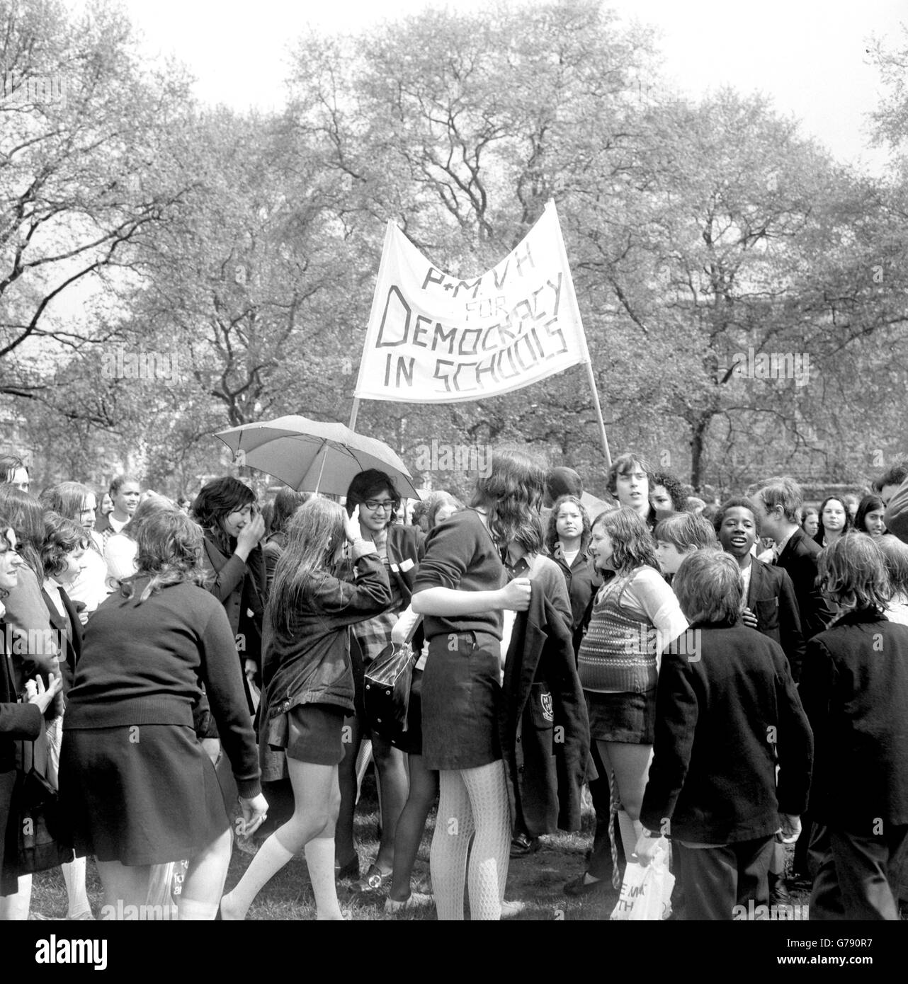 A group of schoolchildren hold a 'pupil power' demonstration at Speaker's Corner in Hyde Park. Children are protesting against caning, detention, uniforms and headmaster dictatorship. Stock Photo