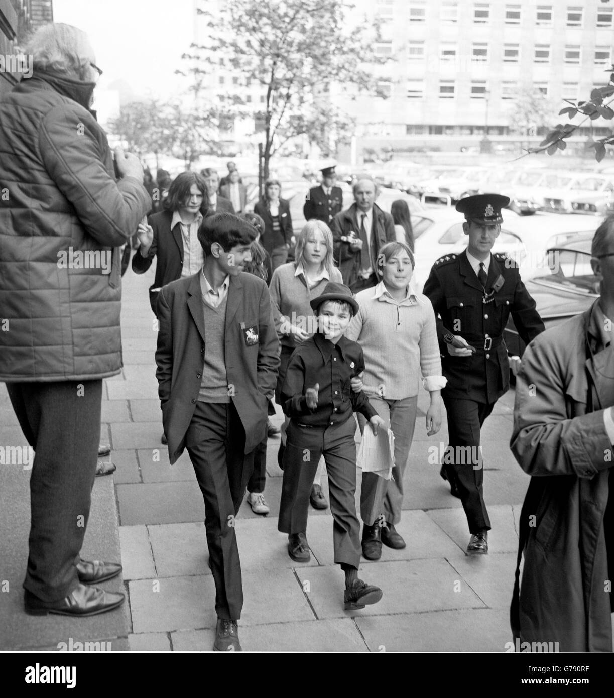 Schoolchildren taking part in a 'pupil power' demonstration march towards County Hall, where they handed in a letter demanding an end to compulsory wearing of school uniform, caning and detention. Stock Photo