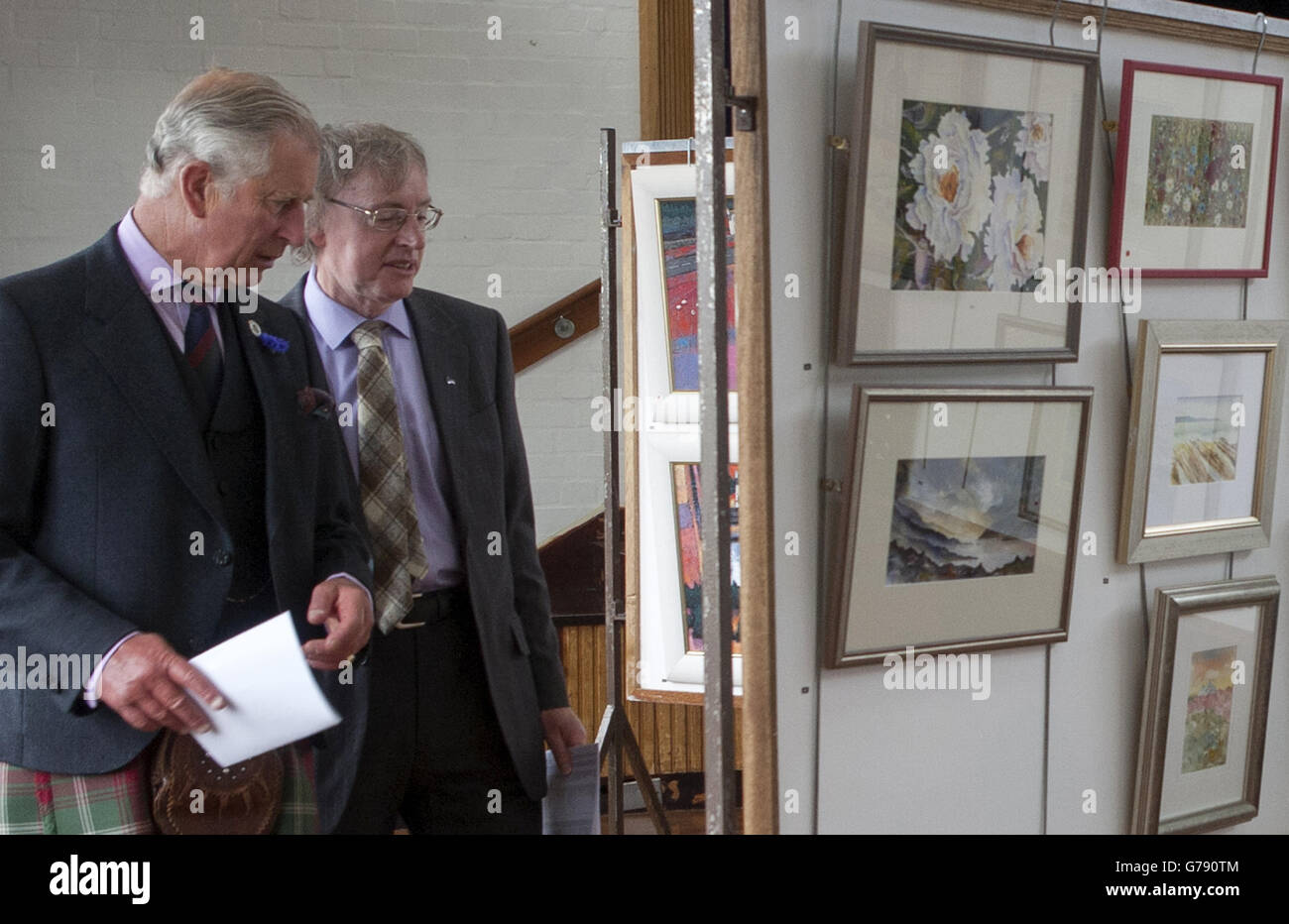 The Duke of Rothesay is shown round the Society of Caithness Artists' exhibition at Thurso High School, by Ian Pearson chairman of the Society of Caithness Artisits. Stock Photo