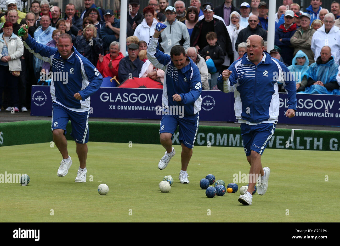 Scotland's (left-right) Paul Foster, Neil Speirs and David Peacock celebrate a shot in their Semi-final Men's Fours match against Australia at Kelvingrove Lawn Bowls Centre, during the 2014 Commonwealth Games in Glasgow. Stock Photo