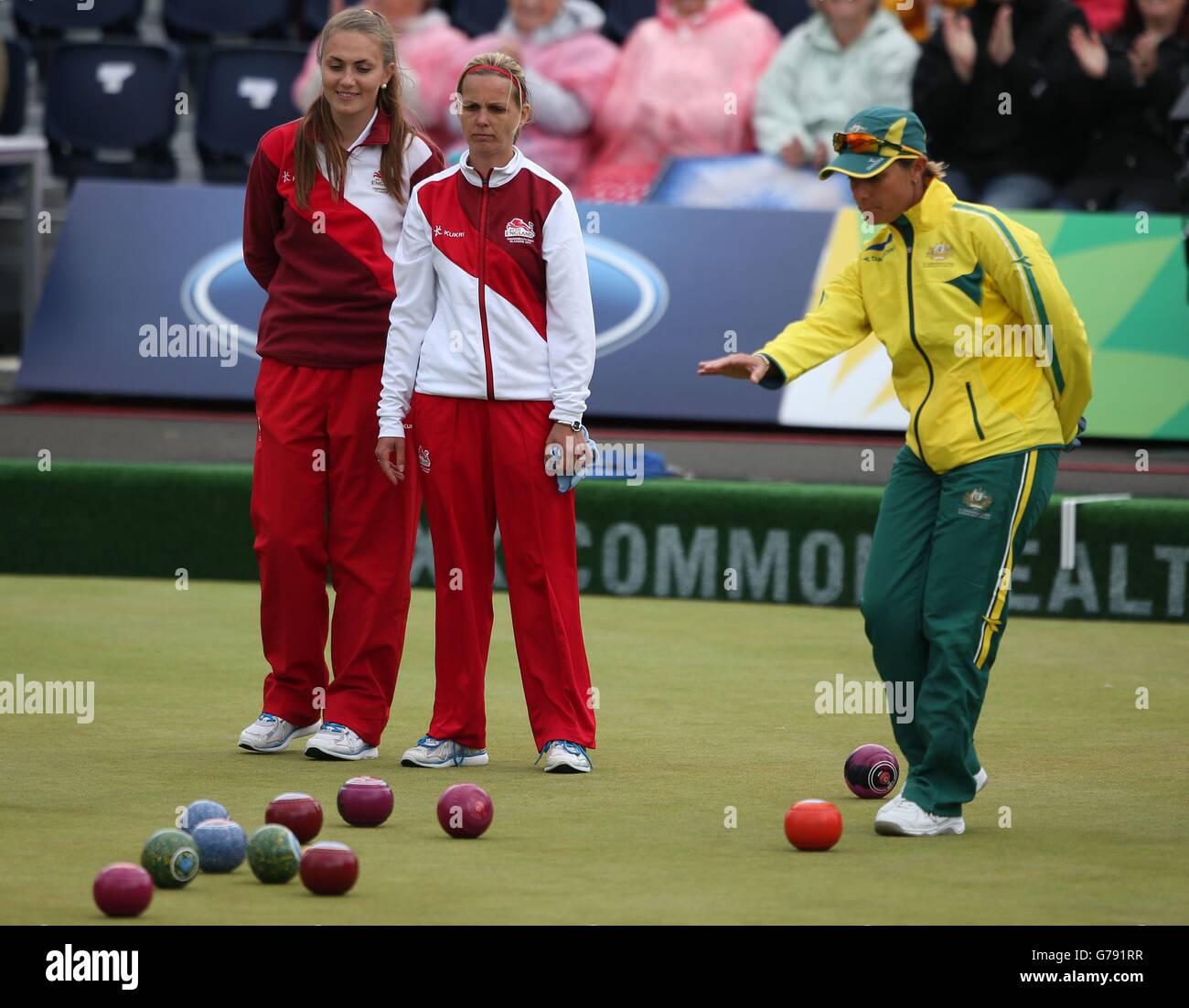 England's Sophie Tolchard and Ellen Falkner watch a shot during the Women's Triples match against Australia at Kelvingrove Lawn Bowls Centre, during the 2014 Commonwealth Games in Glasgow. Stock Photo