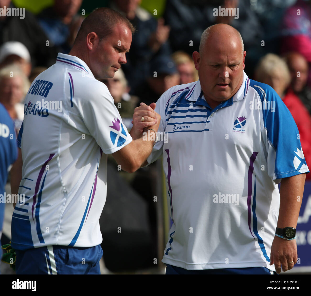 Scotland's Paul Foster and Alex Marshall celebrate a shot in their Semi-final Men's Fours match against Australia at Kelvingrove Lawn Bowls Centre, during the 2014 Commonwealth Games in Glasgow. Stock Photo