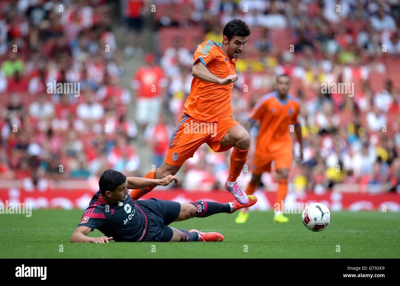 Valencia CF's Rodrigo Moreno Machado skips claer of a challenge from SL Benfica's Benito during the Emirates Cup match at The Emirates Stadium, London. Stock Photo