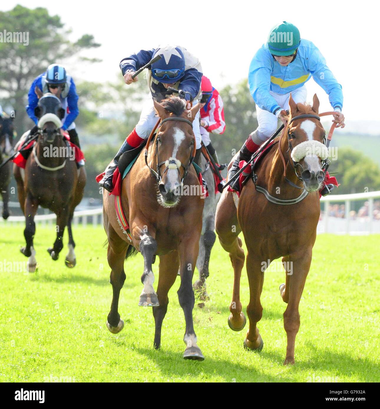 Pyromaniac and jockey Fran Berry (centre) go on to win the Trappers Inn Handicap on day seven of the Galway Festival at Galway Racecourse, Ireland. Stock Photo