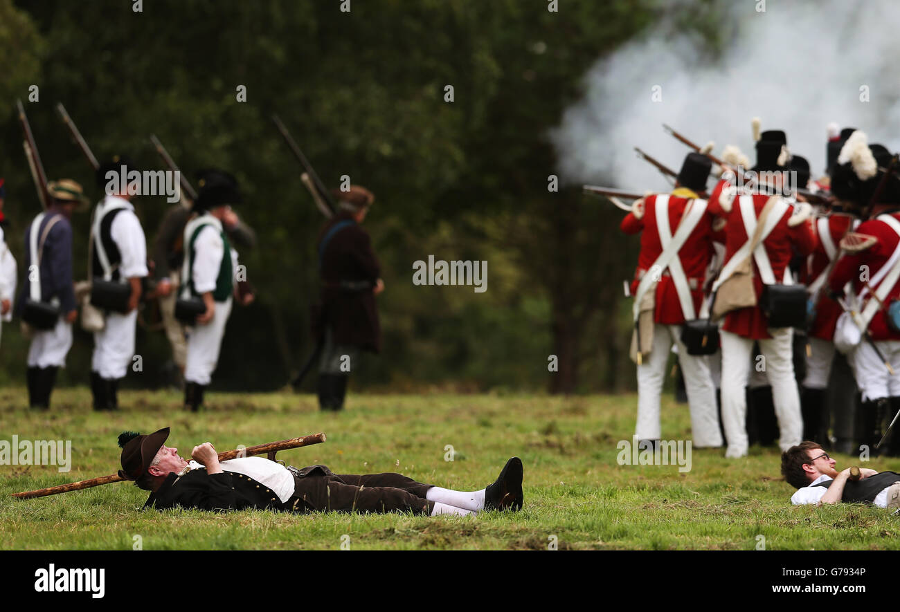 An injured Irish rebel keeps an eye on the action during the Vinegar Hill Battle Re-enactment at Enniscorthy, Co Wexford, Ireland. Stock Photo