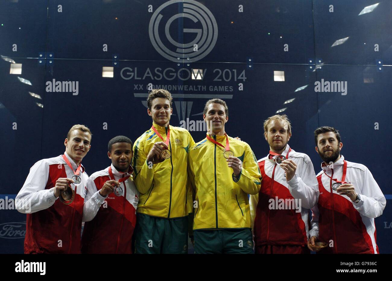 England's Silver medalists Adrian Grant and Nick Matthew (left), Australia's Gold medalists David Palmer and Cameron Pilley (centre) and England's Bronze medalists Daryl Selby and James Willstrop (right) at Scotstoun Sports Campus, during the 2014 Commonwealth Games in Glasgow. Stock Photo