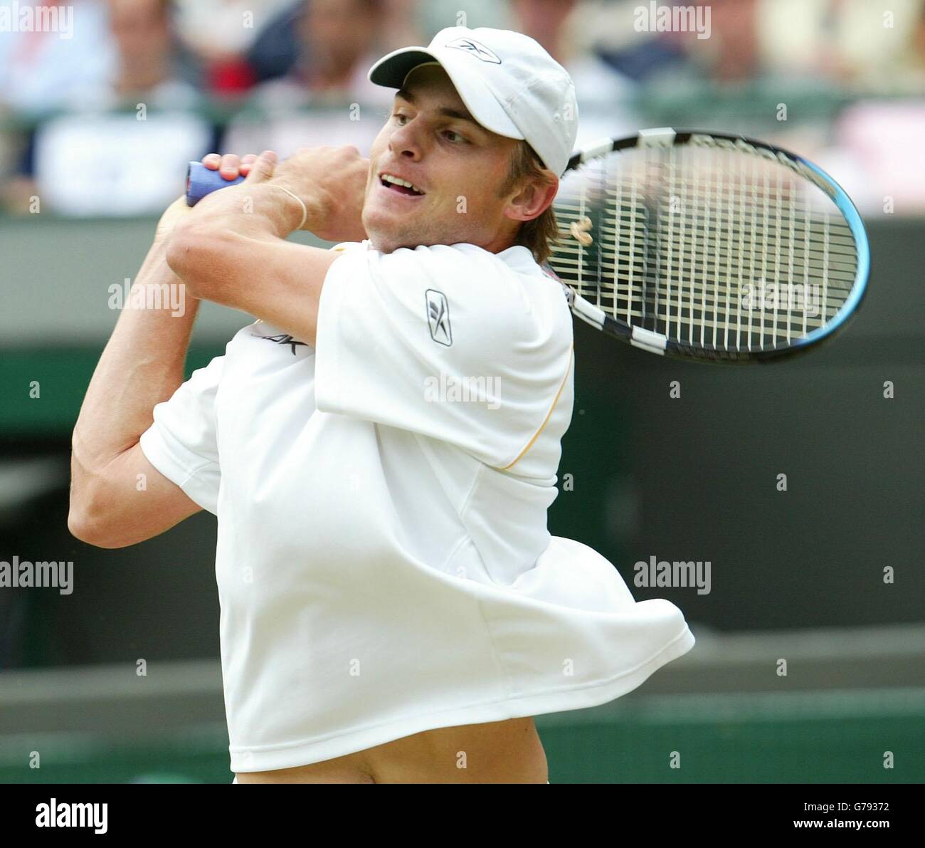 , NO MOBILE PHONE USE. Andy Roddick from the USA in action against Jonas Bjorkman from Sweden during their quarter-final match at the All England Lawn Tennis Championships at Wimbledon. Stock Photo