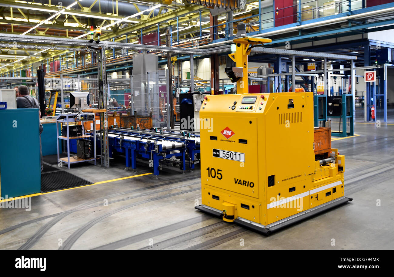 A fully automated transport system brings parts to the manufacturing locations in the factory of Heidelberger Druckmaschinen AG in Brandenburg on the Havel, Germany, 23 June 2016. The location in Brandenburg celebrates its 25th anniversary on 25 June 2016. Here, nearly 500 employees produce around 40 percent of all offset printing marchine parts. Photo: Bernd Settnik/dpa Stock Photo