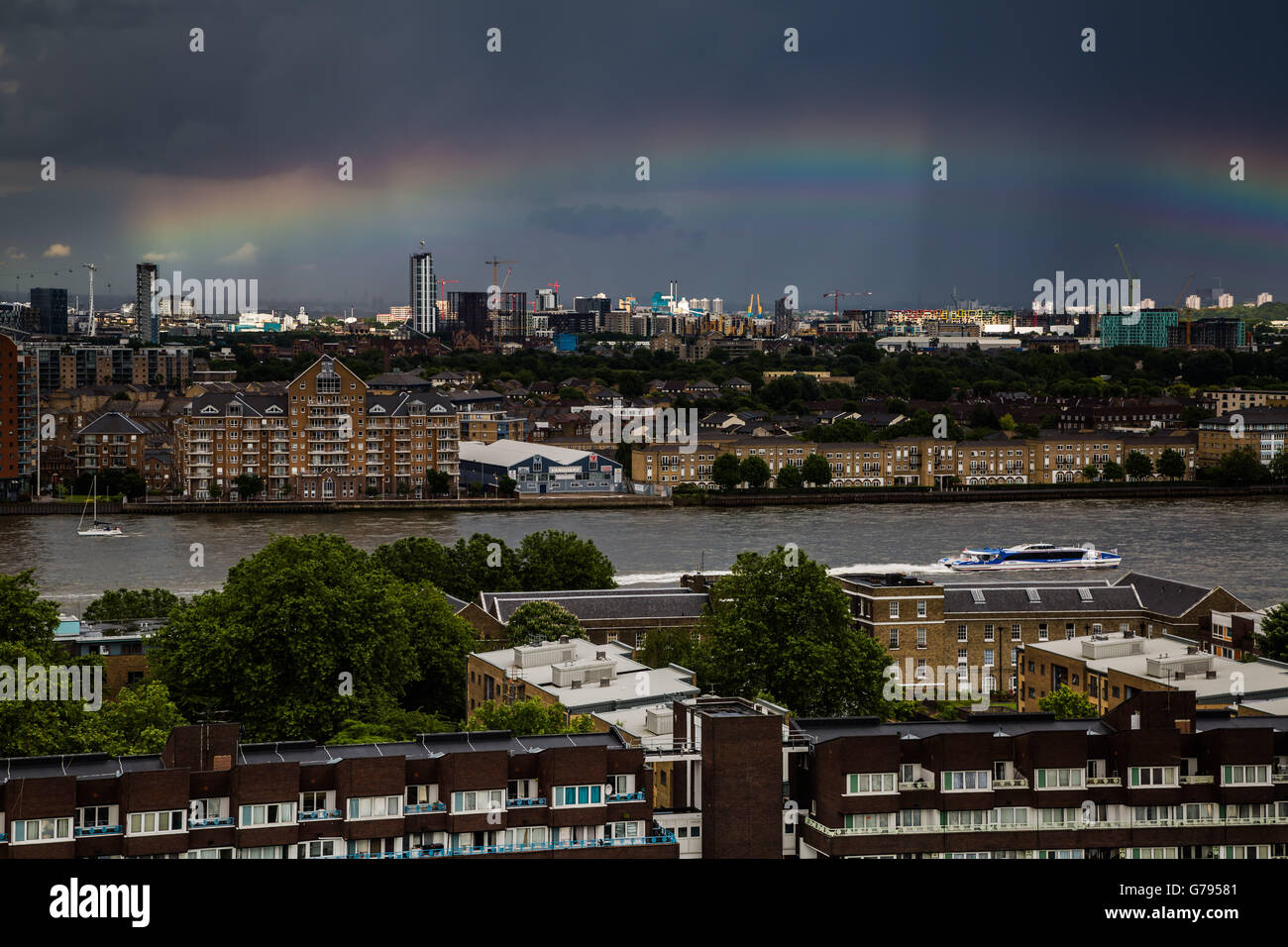 London, UK. 25th June, 2016. UK Weather: Colourful rainbow breaks after a brief rainstorm over south east London and River Thames Credit:  Guy Corbishley/Alamy Live News Stock Photo