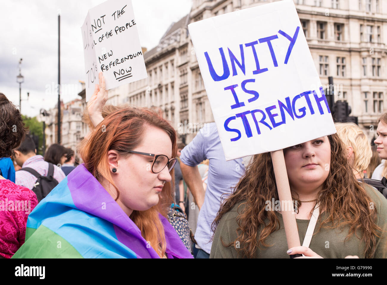 Westminster, London, UK. 25th June, 2016. Young female pro-remain protesters carrying poster saying 'Unity is strength' as part of protests against Brexit in front of the House of Parliament in London, UK. Nicola Ferrari /Alamy Live News Stock Photo