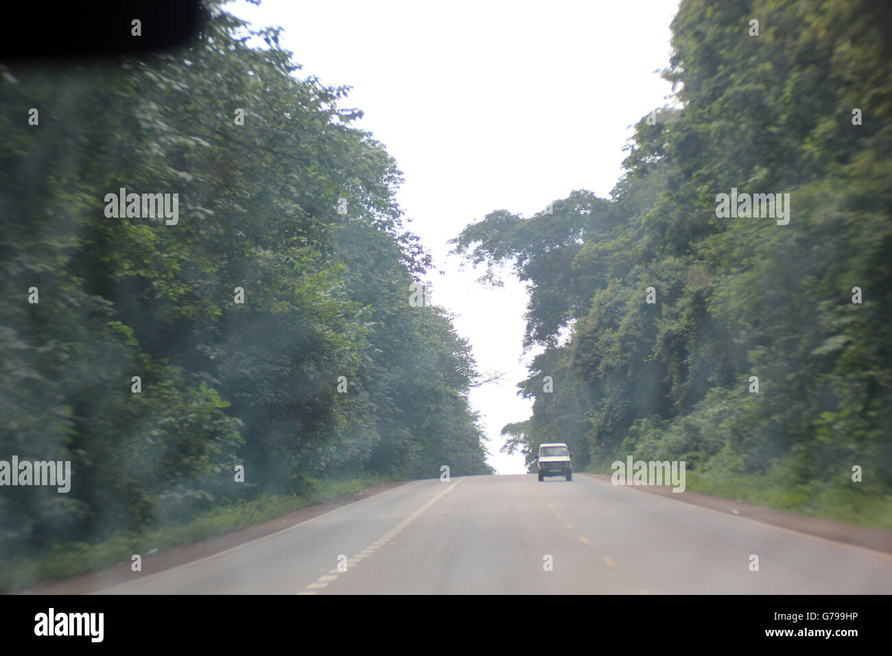 Jinja, Uganda. 25th, June, 2016. A motorist pictured on a misty Kampala