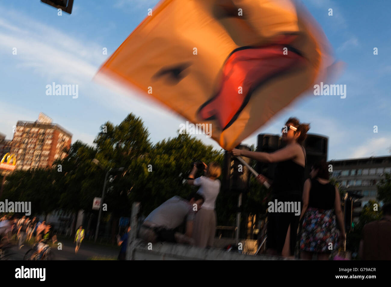 Belgrade, Serbia. 25th June, 2016. Waving yellow duck flag at demonstrations in Belgrade. Yellow duck is symbol of the movement. Milos Bojovic/Alamy Live News Stock Photo