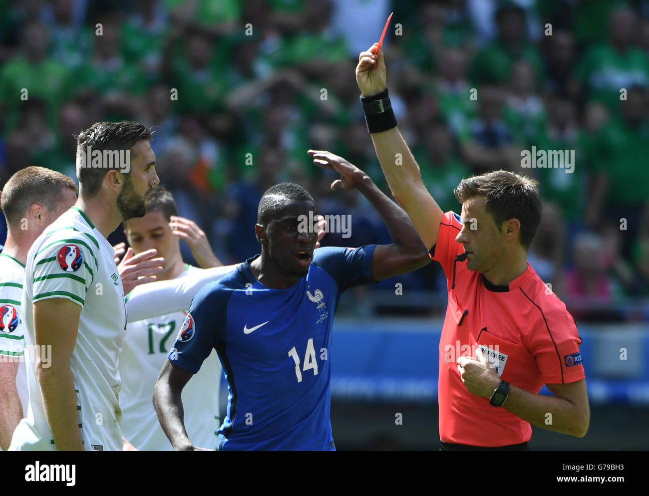 Lyon, France. 26th June, 2016. Republic of Ireland's Shane (L) is shown a referee Nicola Rizzoli for a foul on France's Antoine Griezmann during the Euro 2016 round
