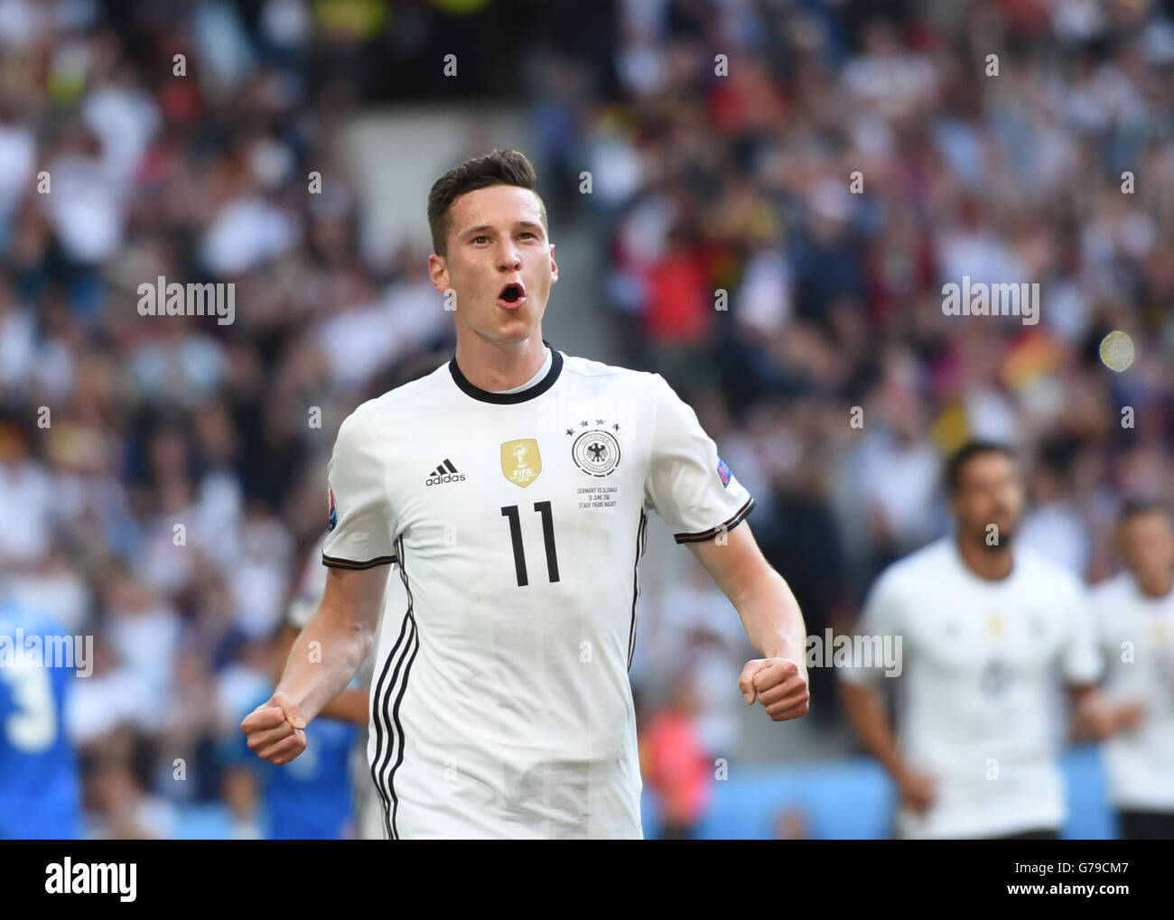 Lille, France. 26th June, 2016. Julian Draxler of Germany celebrates scoring during the Euro 2016 round of 16 football match between Germany and Slovakia in Lille, France, June 26, 2016. Credit:  Tao Xiyi/Xinhua/Alamy Live News Stock Photo