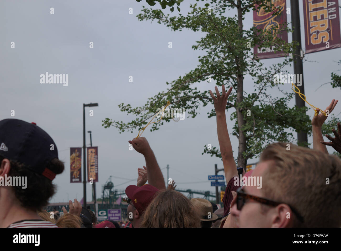 Hands catching beads at Cleveland Cavaliers Championship Parade Stock