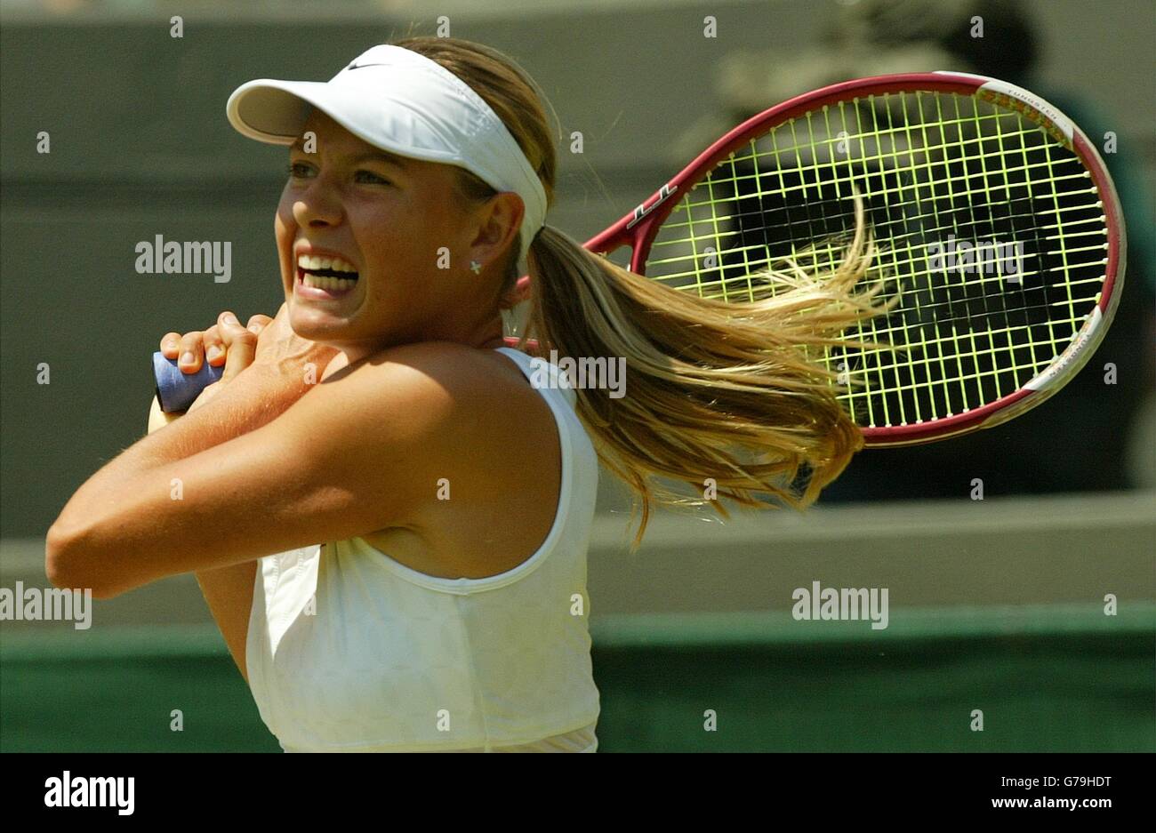 EDITORIAL USE ONLY, NO MOBILE PHONE USE Maria Sharapova from Russia in action against Jelena Dokic from Serbia Montenegro in the third round at the All England Lawn Tennis Championships at Wimbledon. Stock Photo