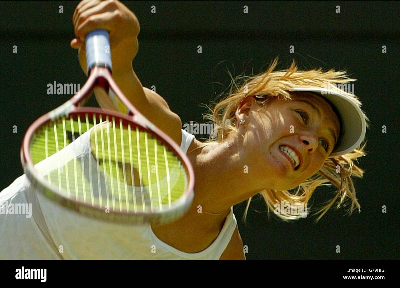EDITORIAL USE ONLY, NO MOBILE PHONE USE Maria Sharapova from Russia in action against Jelena Dokic from Serbia Montenegro in the third round at the All England Lawn Tennis Championships at Wimbledon. Stock Photo