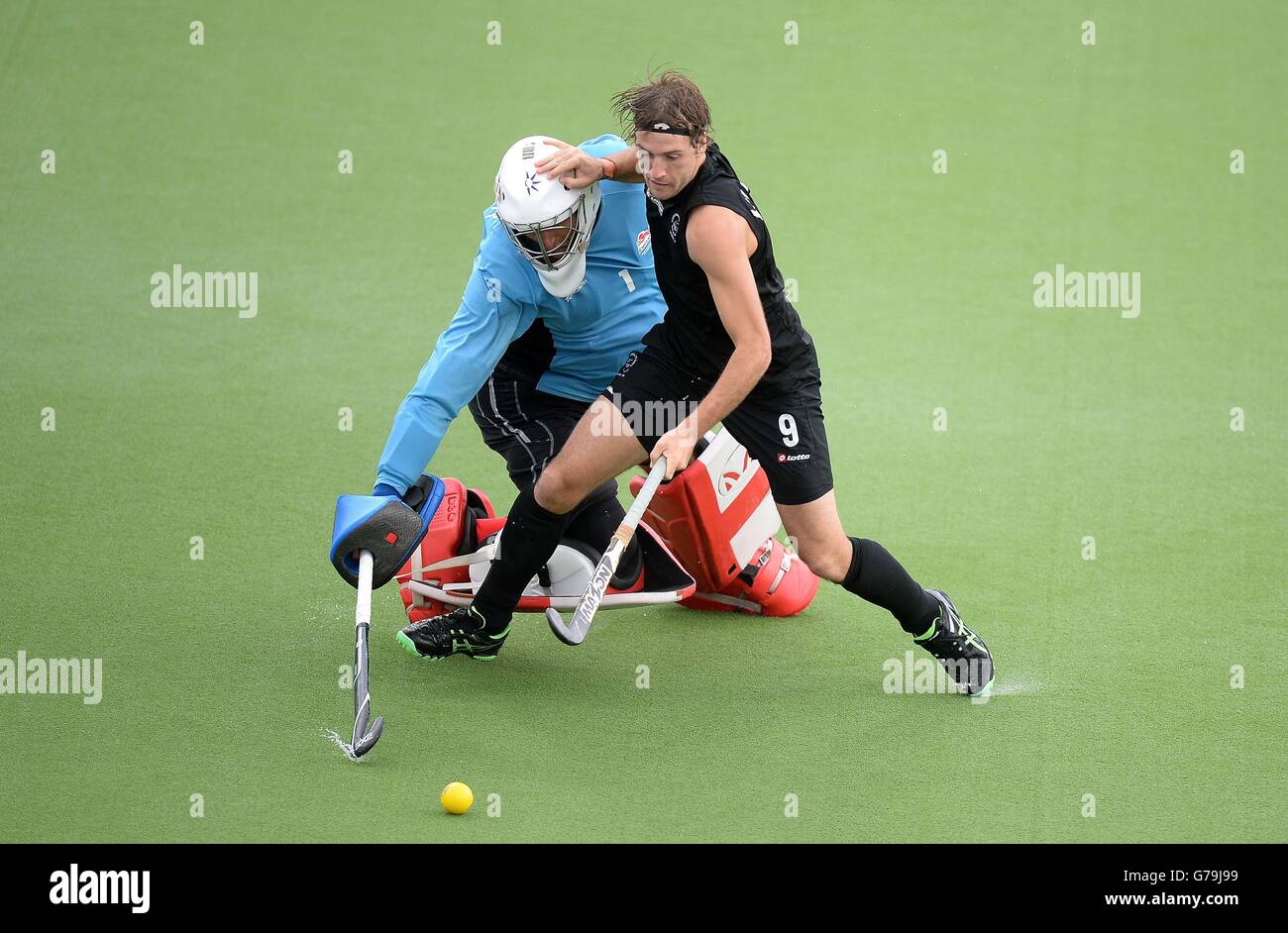 England's George Pinner makes a save from New Zealand's Blair Hilton ...