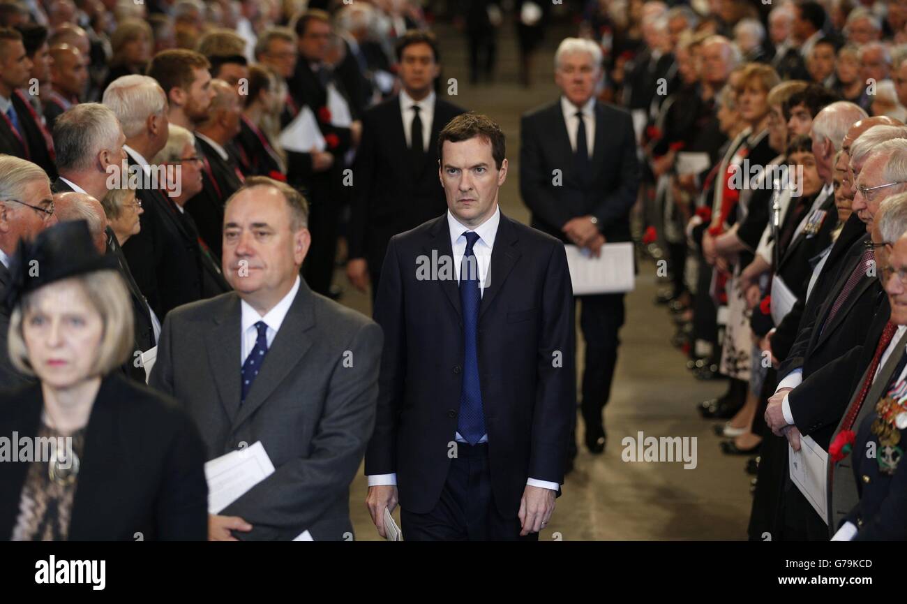 Chancellor of the Exchequer George Osborne stands behind the First Minister of Scotland Alex Salmond, as they leave a service for the Commonwealth to commemorate the 100th anniversary of the outbreak of World War One at Glasgow Cathedral. Stock Photo