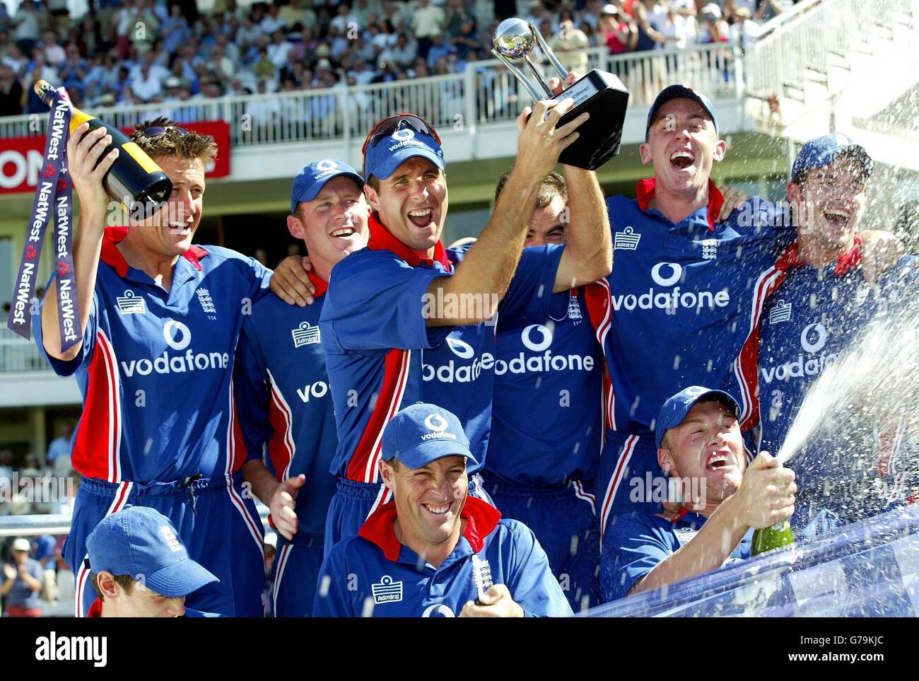 England captain Michael Vaughan leads the England celebrations with the trophy after thier 7 wicket victory over South Africa in The NatWest Series Final at Lords, London. England won by seven wickets. Stock Photo