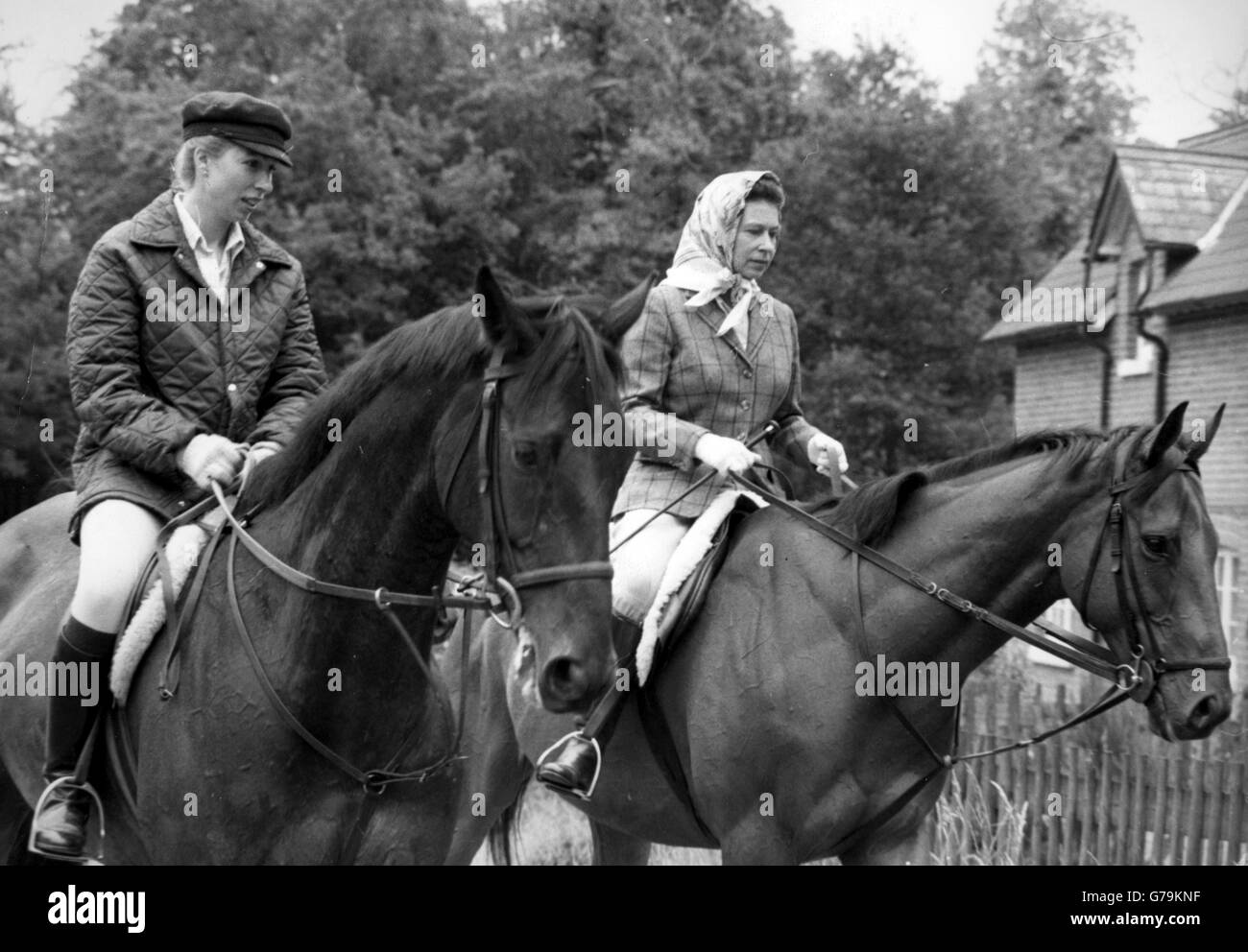 The Queen and Princess Anne riding at Ascot, where they were later among the Royal spectators on Gold Cup day. Stock Photo