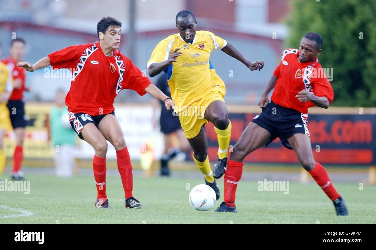 Barry's David Ocquaye steps over challenge by Chinedu Blessing of FK Vardar, at Jenner Park, Barry. NO UNOFFICIAL CLUB WEBSITE USE. Stock Photo