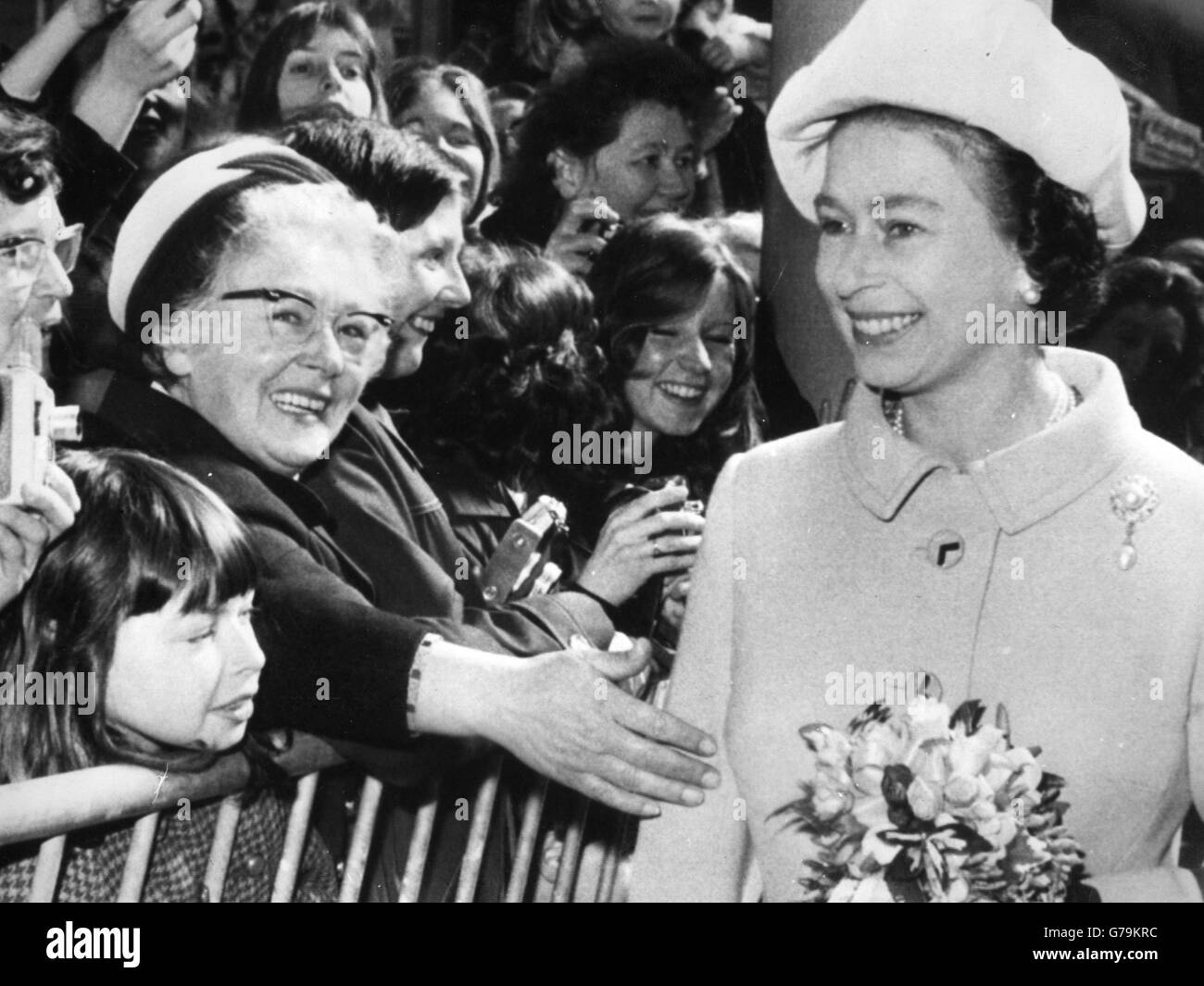 An admirer reaches out to touch the Queen at Preston Railway Station, where she and Prince Philip were boarding a train for a tour of the electrification of the British Railways Anglo-Scottish route between Preston and Glasgow. Stock Photo