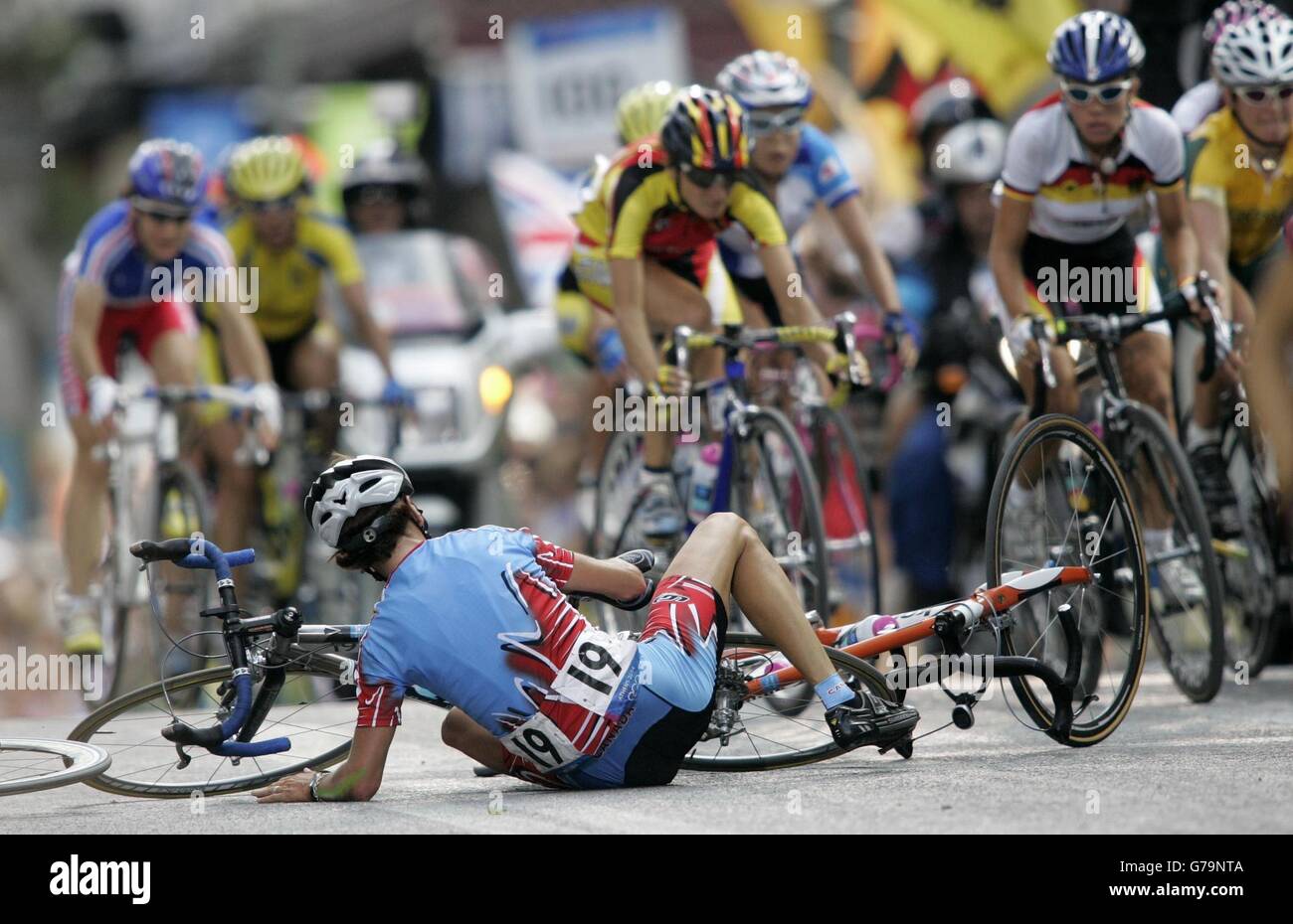 Lyne Bessette. The main pack pass a prone Lyne Bessette following a crash in the Women's Cycling Road Race during the Olympic Games in Athens, Greece. Stock Photo