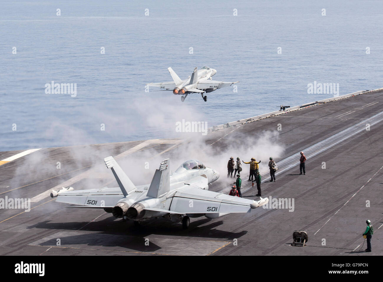 A US Navy F/A-18C Hornet fighter aircraft launches from the flight deck of the aircraft carrier USS Harry S. Truman at June 14, 2016 in the Mediterranean Sea. Stock Photo