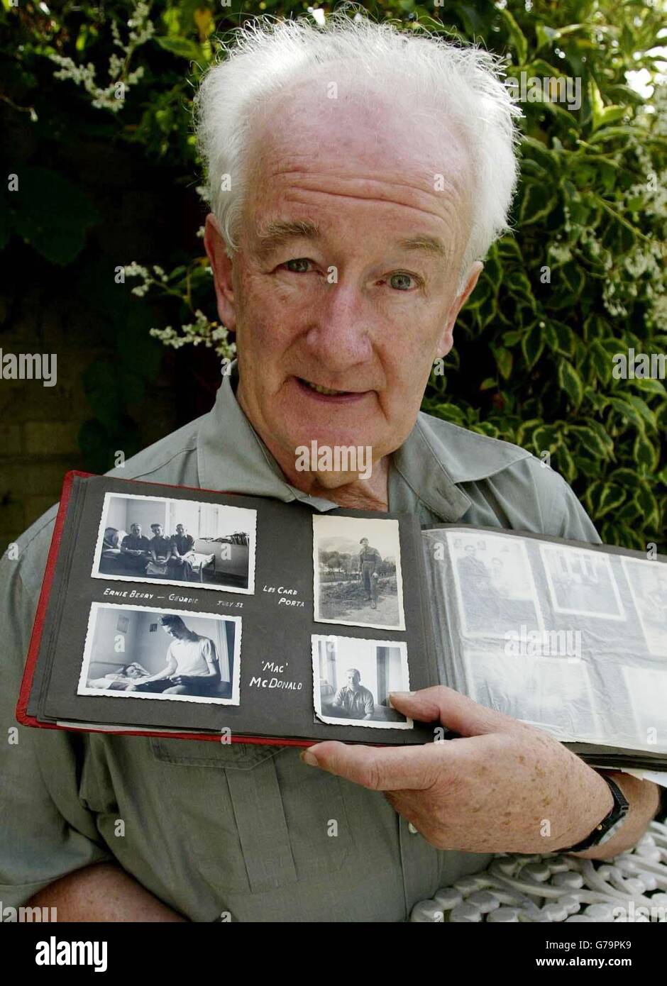 Harry Dillon, 71, from Biddenden, near Ashford, Kent, looks through his photograph album of his time during National Service in Germany in the early 1950s. A postman managed to reunite two ex-Army pals when he delivered a letter addressed to Mr Adam Hastings, aged 70, somewhere in Newcastle upon Tyne. Harry Dillon had not seen his friend since they were demobbed in 1953. A Royal Mail employee in Newcastle went through the local phone book to trace Mr Hastings to the correct address in the Westerhope area of the city and the old soldiers have now talked on the phone to catch up on more than 50 Stock Photo