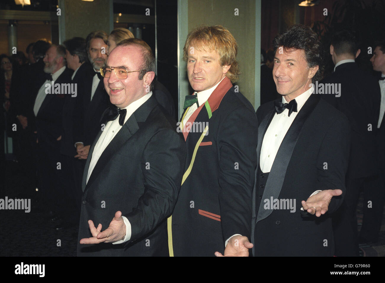 (From l-r) Actors Bob Hoskins, Robin Williams and Dustin Hoffman at the Odeon in Leicester Square, London, for the film premiere of 'Hook', attended by the Princess of Wales and her two sons, Prince William and Harry. Stock Photo