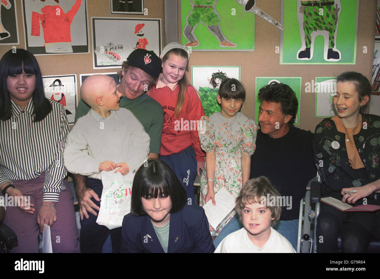 Actors Robin Williams (l) and Dustin Hoffman with some of the children of Great Ormond Street Children's Hospital during their visit in London. Stock Photo