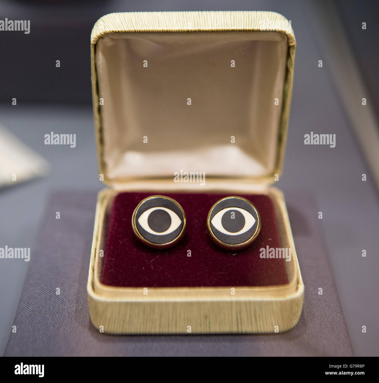 A pair of cufflinks presented to John Lennon to commemorate The Beatles first live appearance on Ed Sullivan Show on February 9, 1964 are part of the Famous and Infamous exhibition which includes highlights from the collection of Jersey collector David Gainsborough Roberts at Christie's in London. Stock Photo