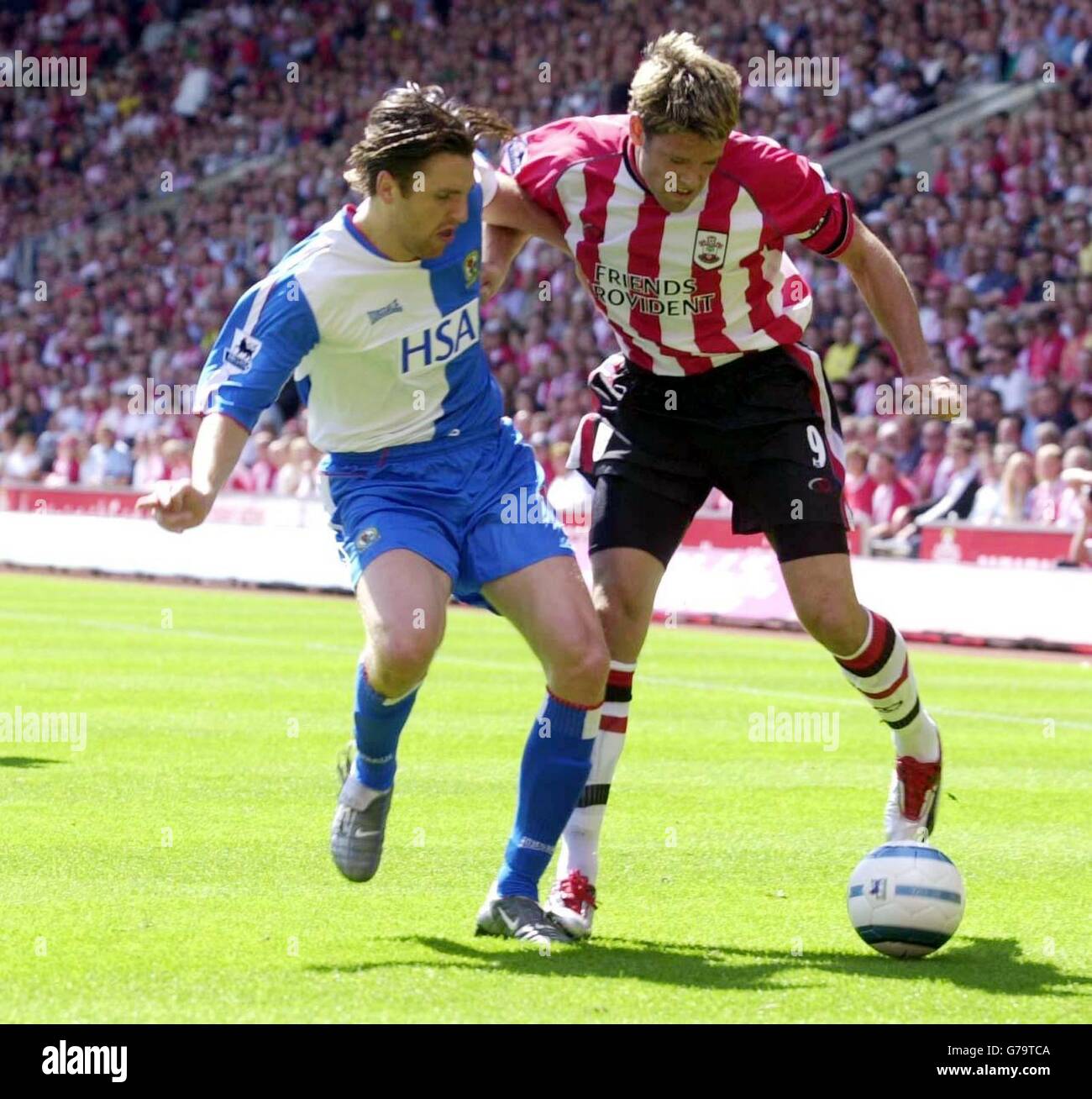 Blackburn Rovers' Tugay (L) tackles with Southampton's James Beatie during their Barclays Premiership match at St Mary's Stadium. Stock Photo