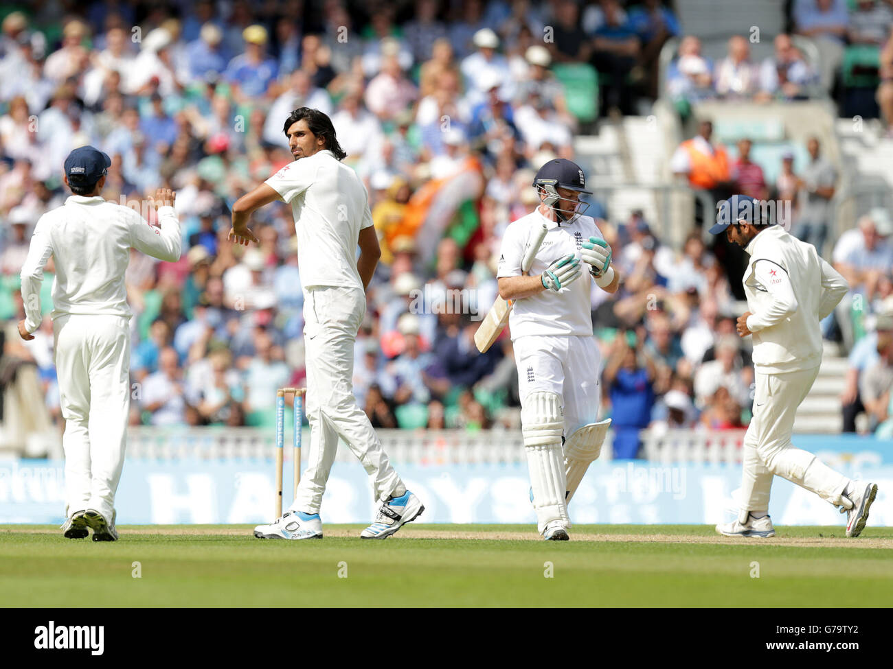 England's Ian Bell loses his wicket to the bowling of India's Ishant Sharma (second from left) during the Fifth Test at The Kia Oval, London. Stock Photo