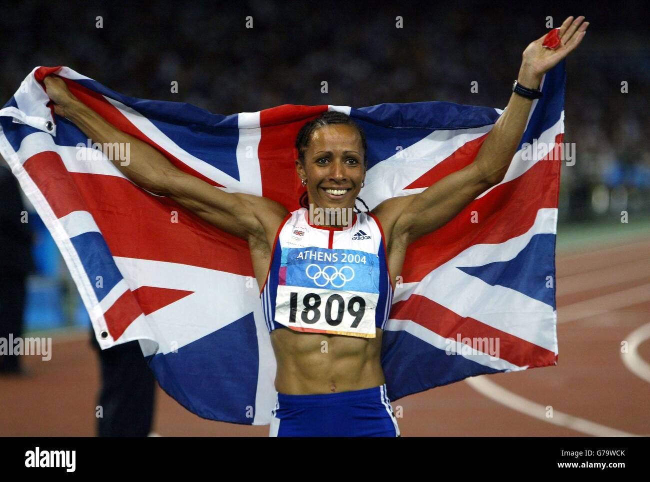 Great Britain's gold medal winner Kelly Holmes celebrates winning the 800m at the Olympic Stadium during the Olympic Games in Athens, Greece. Stock Photo