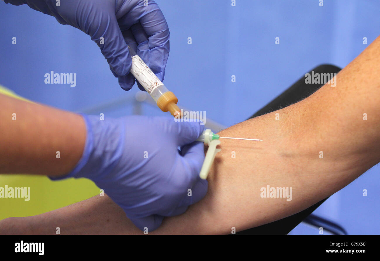 A medical professional prepares to inject a patient's arm at the Royal ...